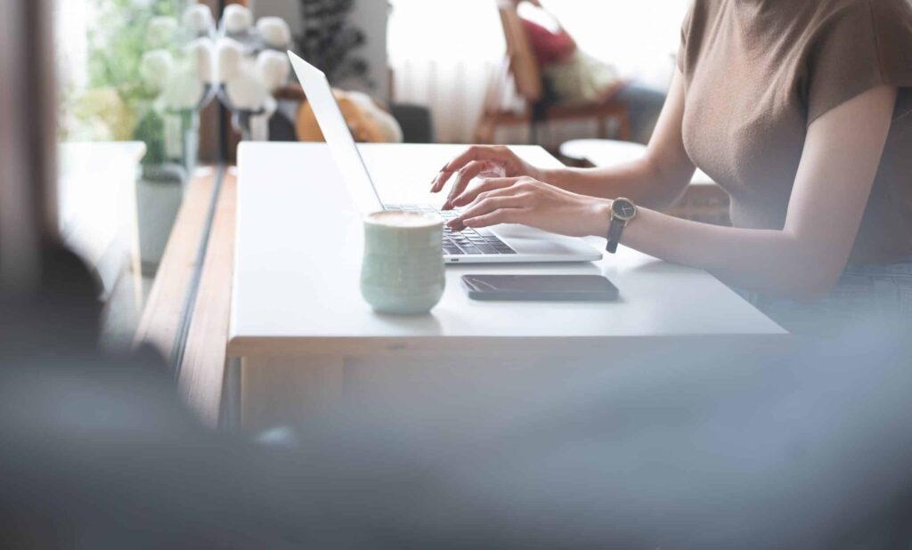 Woman Typing on laptop